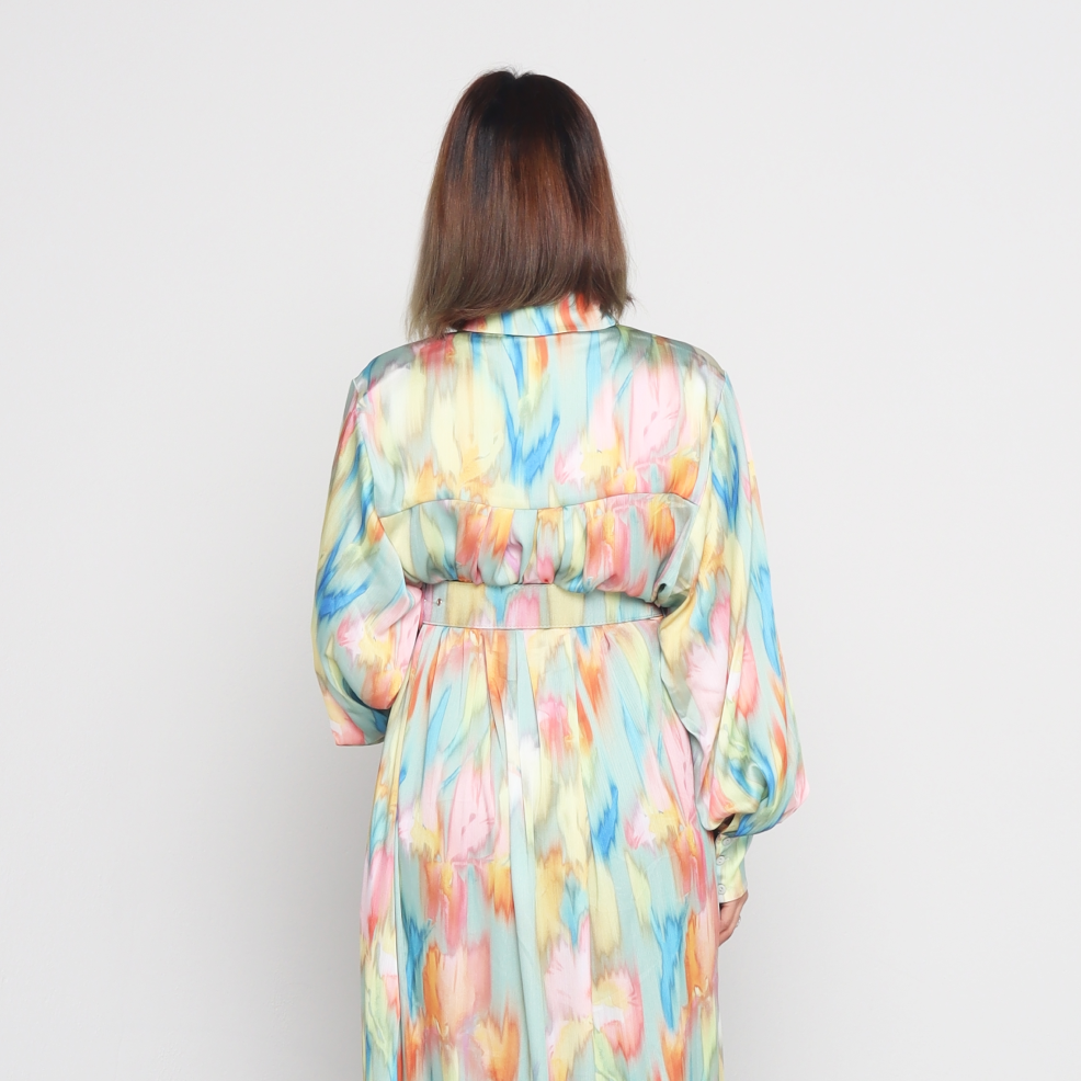 Woman wearing  fashionable  Colorful flowy Rainbow Yoryo satin hidden buttons side pockets collar neck long balloon sleeves maxi dress with detachable belt back view